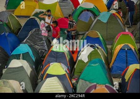 Indigenous members of the CRIC and other indigenous associations of Colombia, camp at 'El Palacio de los Deportes' after a week long trip on colombian roads to protest against the social leaders assasinations, the massacres in the country, and the implementation of the peace process, in Bogota, Colombia, october 20, 2020. Indigenous leaders gave a press conferences along orginizers of the national strike to show support in the demonstrations that will take in the city on october 21. (Photo by Sebastian Barros/NurPhoto) Stock Photo