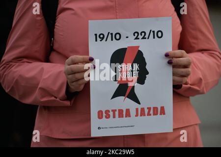 Pro-Choice activist holding a logo of the 'Women Strike', seen in the center of Krakow, part of the Coronavirus Red Zone, during a protest against a proposed law that prohibits abortion for irreversible damage to the fetus. Tomorrow, on Thursday, October 22, the Constitutional Tribunal is to consider the motion of a group of PiS (Law and Justice rulling party) deputies regarding the constitutionality of the so-called Eugenic abortion, performed in case of suspicion of a child's disease or its impairment. A group of PiS MPs submitted an application to the Constitutional Tribunal. On October 21, Stock Photo