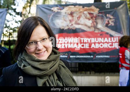 Kaja Godek, key anti-abortion activist next to her organisation's banners with fetuses. The Constitutional Court was deciding to ban abortions for fetal indications, in Warsaw, Poland, on October 22, 2020. Outside of the the court activists from both sides gathered in prayers for the judges to introduce the ban or in protest against limiting women reproductive rights. (Photo by Piotr Lapinski/NurPhoto) Stock Photo