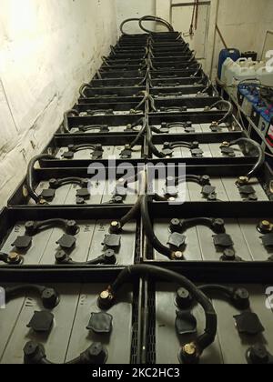 emergency batteries connected in series from a ships battery room,battery room,emergency batteries,battery,cells,ships battery room,accumalator,DC pow Stock Photo