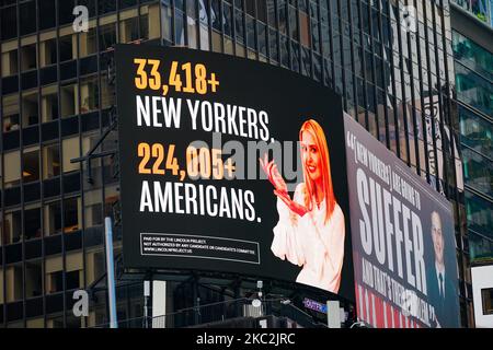 A view of Lincoln Project Billboard Times Square that depicts Ivanka trump presenting the number of New Yorkers and americans who have died of Covid-19 and Jared Kushner next to a Vanity Fair quote on October 25, 2020. (Photo by John Nacion/NurPhoto) Stock Photo