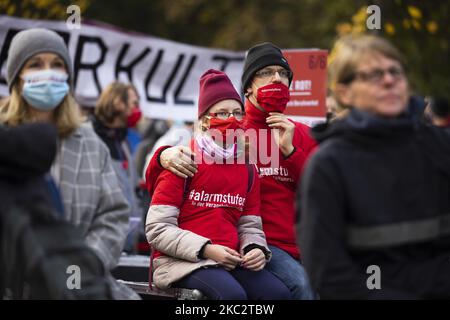 People and employees of the event industry attend a demonstration under the motto Alarmstufe Rot (Alarm level red) to protest against measures considered too hard and damaging of the sector and demand government assistance during the second wave of the coronavirus pandemic on October 28, 2020 in Berlin, Germany. (Photo by Emmanuele Contini/NurPhoto) Stock Photo