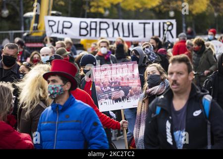 People and employees of the event industry attend a demonstration under the motto Alarmstufe Rot (Alarm level red) to protest against measures considered too hard and damaging of the sector and demand government assistance during the second wave of the coronavirus pandemic on October 28, 2020 in Berlin, Germany. (Photo by Emmanuele Contini/NurPhoto) Stock Photo