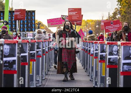 People and employees of the event industry attend a demonstration under the motto Alarmstufe Rot (Alarm level red) to protest against measures considered too hard and damaging of the sector and demand government assistance during the second wave of the coronavirus pandemic on October 28, 2020 in Berlin, Germany. (Photo by Emmanuele Contini/NurPhoto) Stock Photo