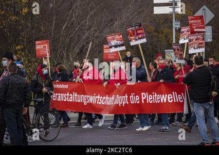 People and employees of the event industry attend a demonstration under the motto Alarmstufe Rot (Alarm level red) to protest against measures considered too hard and damaging of the sector and demand government assistance during the second wave of the coronavirus pandemic on October 28, 2020 in Berlin, Germany. (Photo by Emmanuele Contini/NurPhoto) Stock Photo