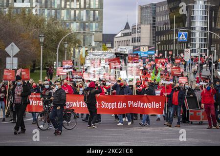 People and employees of the event industry attend a demonstration under the motto Alarmstufe Rot (Alarm level red) to protest against measures considered too hard and damaging of the sector and demand government assistance during the second wave of the coronavirus pandemic on October 28, 2020 in Berlin, Germany. (Photo by Emmanuele Contini/NurPhoto) Stock Photo