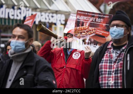 People and employees of the event industry attend a demonstration under the motto Alarmstufe Rot (Alarm level red) to protest against measures considered too hard and damaging of the sector and demand government assistance during the second wave of the coronavirus pandemic on October 28, 2020 in Berlin, Germany. (Photo by Emmanuele Contini/NurPhoto) Stock Photo