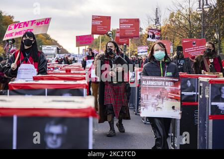 People and employees of the event industry attend a demonstration under the motto Alarmstufe Rot (Alarm level red) to protest against measures considered too hard and damaging of the sector and demand government assistance during the second wave of the coronavirus pandemic on October 28, 2020 in Berlin, Germany. (Photo by Emmanuele Contini/NurPhoto) Stock Photo