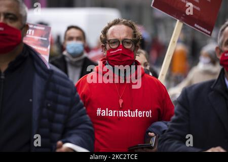 People and employees of the event industry attend a demonstration under the motto Alarmstufe Rot (Alarm level red) to protest against measures considered too hard and damaging of the sector and demand government assistance during the second wave of the coronavirus pandemic on October 28, 2020 in Berlin, Germany. (Photo by Emmanuele Contini/NurPhoto) Stock Photo