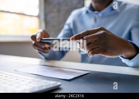 Remote Check Deposit Using Mobile Remote. Taking Photo Stock Photo
