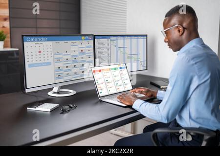 Kanban Project Management Software On Laptop. Digital Calendar Schedule Stock Photo