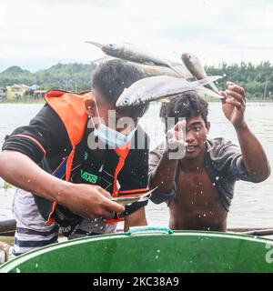 Because of the strong of Typhoon Rolly small scale fishermen in Binangonan, Rizal, Philippines are selling Bangus on November 2, 2020. The Binangonan Fish Port are destroyed caused by Typhoon Rolly. (Photo by Ryan Eduard Benaid/NurPhoto) Stock Photo