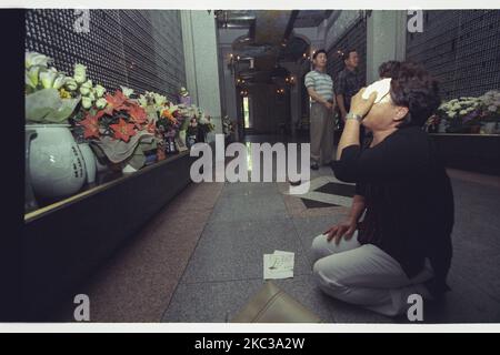 This Pictures taken date is 2000. Korean War dead family visit National Cemetery after cherish in Seoul, South Korea. The Seoul National Cemetery located in Dongjak-dong, Dongjak-gu, Seoul, South Korea. When established by presidential decree of Syngman Rhee in 1956, it was the country's only national cemetery. As the cemetery reached capacity in the early 1970s, Daejeon National Cemetery was established in 1976. Both cemeteries had been overseen by the South Korean Ministry of Defence until 2005 but in 2006 the Daejeon National Cemetery was transferred to the Ministry of Patriots' and Veteran Stock Photo