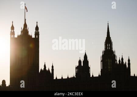 A Union Jack flag flies from the top of the Victoria Tower of the Houses of Parliament in London, England, on November 6, 2020. England yesterday began its second national coronavirus lockdown, announced by British Prime Minister Boris Johnson last Saturday, citing fears that covid-19 again threatened to overwhelm the National Health Service (NHS). Pubs, bars, restaurants and non-essential shops are all required to be closed until the currently scheduled end date of December 2. People have meanwhile been asked to stay home as much as possible, although schools and other educational institution Stock Photo