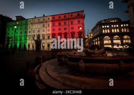 View of Palazzo Chigi, seat of the Italian Government with the colours of the Italian flag on November 7, 2020 in Rome, Italy. The Italian government imposed a new regional blockade from yesterday 6 November to 3 December, after a sharp increase in COVID-19 cases. People will only be able to leave their homes from 22:00 to 05:00 for work or health reasons. Italy recorded over 39,811 new infections and 425 deaths in the last 24 hours. (Photo by Andrea Ronchini/NurPhoto) Stock Photo