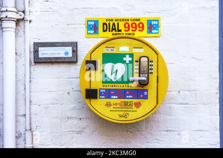 An AED (defibrillator) attached the wall of a pub in Banbury. Stock Photo