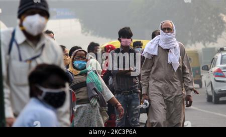 People use masks as a precautionary measure against Covid-19 as well as deteriorating air quality under heavy smog conditions near INA Market in New Delhi on November 9, 2020. The national capital's air quality remained ''severe'' for the fifth consecutive day with AQI reading of 474, with calm wind speed exacerbating the effect of stubble burning. (Photo by Mayank Makhija/NurPhoto) Stock Photo