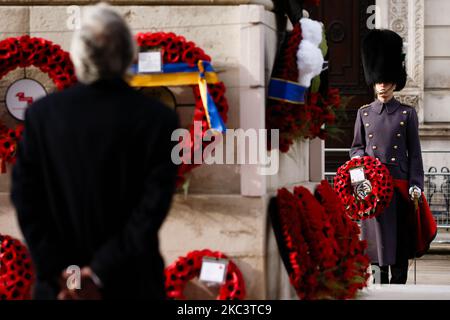 A soldier carrying a wreath of poppies stands to attention during an Armistice Day service at the Cenotaph war memorial on Whitehall in London, England, on November 11, 2020. (Photo by David Cliff/NurPhoto) Stock Photo