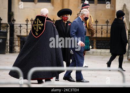 Prince Charles, the Prince of Wales, and Camilla, Duchess of Cornwall, wear face masks as they leave an Armistice Day service at Westminster Abbey in London, England, on November 11, 2020. (Photo by David Cliff/NurPhoto) Stock Photo