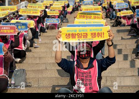 Union members of the railway union shout slogans during a press conference declaring a struggle for safety operations at Seoul Station in Yongsan-gu on November 12, 2020 in Seoul, South Korea. They say they work for only a minimum wage for 20 years, and also demand a realistic wage increase and stable employment. (Photo by Chris Jung/NurPhoto) Stock Photo