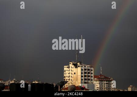 A rainbow rises over Gaza City after a rain shower on November 15, 2020. (Photo by Majdi Fathi/NurPhoto) Stock Photo