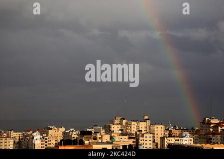 A rainbow rises over Gaza City after a rain shower on November 15, 2020. (Photo by Majdi Fathi/NurPhoto) Stock Photo