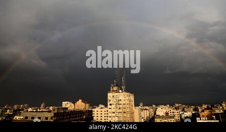 A rainbow rises over Gaza City after a rain shower on November 15, 2020. (Photo by Majdi Fathi/NurPhoto) Stock Photo