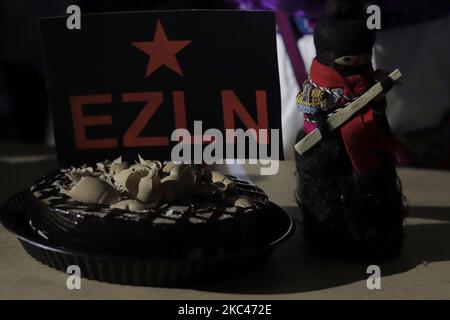 Members of the Otomí community in the occupation of the National Institute of Indigenous Peoples in Mexico City, during cake cutting and celebrations to mark the 37th anniversary of the Zapatista Army of National Liberation (EZLN) in Mexico. The origins of the EZLN go back to the early years of the 1980s, when a small guerrilla group made up of mestizos and indigenous peoples settled in the mountainous area of the Lacandon Jungle, in Chiapas, with the intention of creating a front that would promote the struggle armed in the country. (Photo by Gerardo Vieyra/NurPhoto) Stock Photo