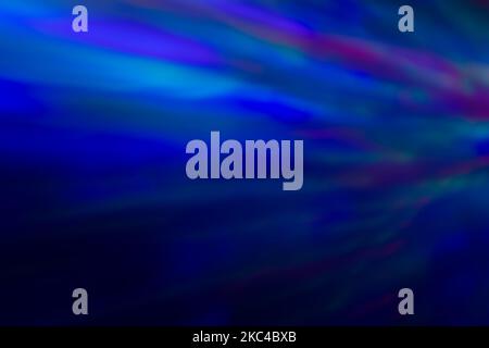 Abstract photo of motion and blurred colorful lights at dark. Abstract high resolution defocused background. Copy space. Stock Photo