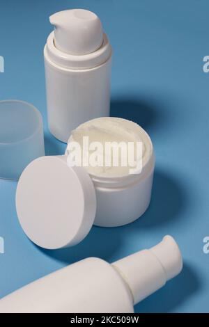 close up of mock up white jar with cream on a blue background  Stock Photo