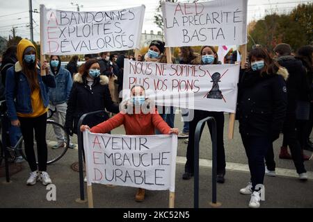 Educationnal assistants (AED in French) gathered in front of the Board of Education of the Occitanie region because they have a lot more work to do with the protective measures to be applied with the Covid-19 and because they hadn't have any bonus for their work during the pandemic unlike teachers and principals. They complain they can't do more than 6 years as educationnal assistants as the Ministry of Education don't authorize them to stay more in this job. After 6 years, they are fired. The strike was nation wide. Toulouse. France. December 1st 2020. (Photo by Alain Pitton/NurPhoto) Stock Photo