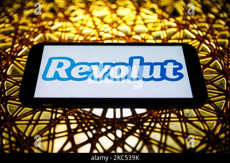 Revolut logo is seen displayed on a phone screen in this illustration photo taken in Poland on November 30, 2020. (Photo by Jakub Porzycki/NurPhoto) Stock Photo
