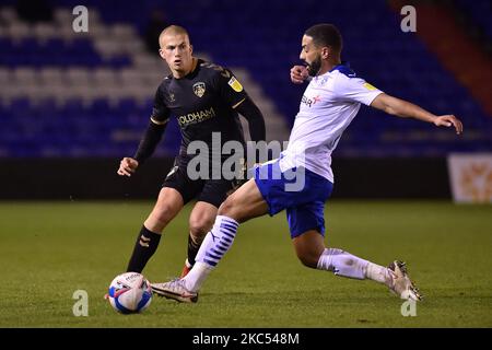 Oldham Athletic's Harry Clarke clears from Tranmere Rovers' Liam Feeney during the Sky Bet League 2 match between Oldham Athletic and Tranmere Rovers at Boundary Park, Oldham on Tuesday 1st December 2020. (Photo by Eddie Garvey/MI News/NurPhoto) Stock Photo