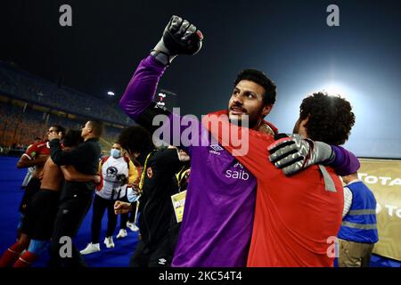 Players of Al Ahly celebrate with the trophy of CAF Champions League after winning the final match between Zamalek and Al Ahly at Cairo stadium on 27 November, 2020 in Cairo, Egypt. (Photo by Ahmed Awaad/NurPhoto) Stock Photo