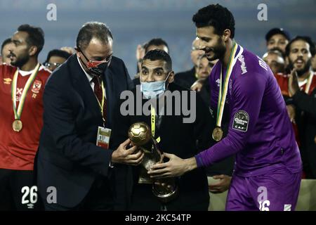 Players of Al Ahly celebrate with the trophy of CAF Champions League after winning the final match between Zamalek and Al Ahly at Cairo stadium on 27 November, 2020 in Cairo, Egypt. (Photo by Ahmed Awaad/NurPhoto) Stock Photo