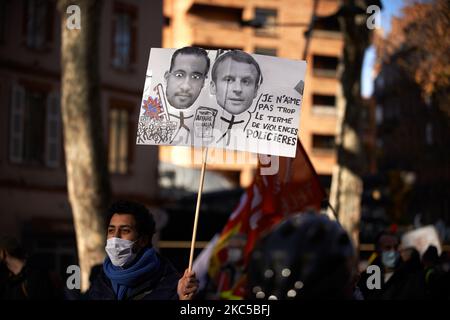 A man holds a placard depicting President Macron and Benalla. It reads 'I don't like much the term 'police violences''. Called by several trade unions, people joined a protest against precarity, poverty and the change of rules for unemployment benefits by Pole Emploi (French governmental agency which registers unemployed people, helps them find jobs and provides them with financial benefits). As the economic crisis bites due to the covid-19 lockdowns, the number of poor people explodes in France. They're worried about the numerous jobs cut annouced in the aftermath of the first and second wave Stock Photo