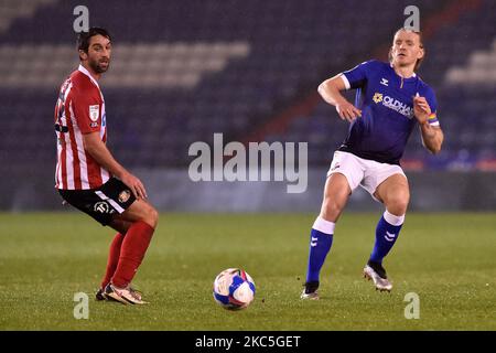 Oldham Athletic's Carl Piergianni tussles with Sunderland's Will Grigg during the EFL Trophy match between Oldham Athletic and Sunderland at Boundary Park, Oldham on Tuesday 8th December 2020. (Photo by Eddie Garvey/MI News/NurPhoto) Stock Photo