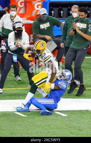 Green Bay Packers wide receiver Marquez Valdes-Scantling (83) is tackled by Detroit Lions cornerback Amani Oruwariye (24) during the second half of an NFL football game between the Green Bay Packers and the Detroit Lions in Detroit, Michigan USA, on Sunday, December 13, 2020. (Photo by Amy Lemus/NurPhoto) Stock Photo