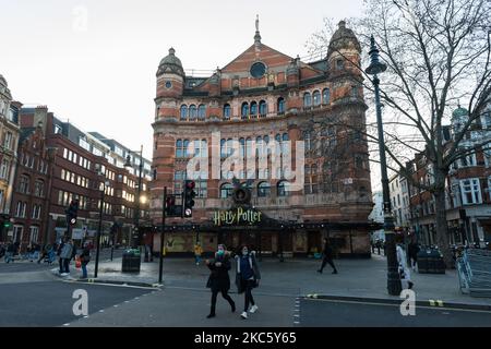 Pedestrians walk past Palace Theatre in the West End ahead of introduction of tougher coronavirus restrictions in the run up to Christmas, on 15 December, 2020 in London, England. From tomorrow, Greater London, as well as parts of Essex and Hertfordshire, will move into Tier 3 coronavirus restrictions resulting in closing of pubs, bars, restaurants, hotels and indoor entertainment venues such as theatres and cinemas, as the infection rates are well above the national average and continue to rise. (Photo by WIktor Szymanowicz/NurPhoto) Stock Photo