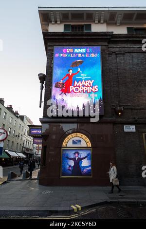 Pedestrians walk past the Prince Edward Theatre in the West End ahead of introduction of tougher coronavirus restrictions in the run up to Christmas, on 15 December, 2020 in London, England. From tomorrow, Greater London, as well as parts of Essex and Hertfordshire, will move into Tier 3 coronavirus restrictions resulting in closing of pubs, bars, restaurants, hotels and indoor entertainment venues such as theatres and cinemas, as the infection rates are well above the national average and continue to rise. (Photo by WIktor Szymanowicz/NurPhoto) Stock Photo