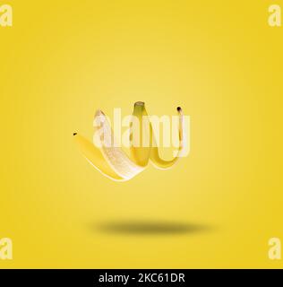 Contemporary art collage. Levitating banana peel. Modern food concept. Stock Photo