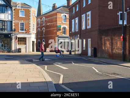 Old people crossing a street in Uttoxeter, Staffordshire, UK Stock Photo