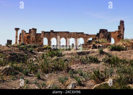 The ruins of the ancient Roman town of Volubilis in Meknes, Morocco, Africa. Volubilis is a partly excavated Roman city built in the 3rd century BC onwards as a Phoenician (and later Carthaginian) settlement. The site was excavated and revealed many fine mosaics, including some of the more prominent public buildings and high-status houses were restored or reconstructed. Today it is a UNESCO World Heritage Site , listed for being 'an exceptionally well preserved example of a large Roman colonial town on the fringes of the Empire'. (Photo by Creative Touch Imaging Ltd./NurPhoto) Stock Photo