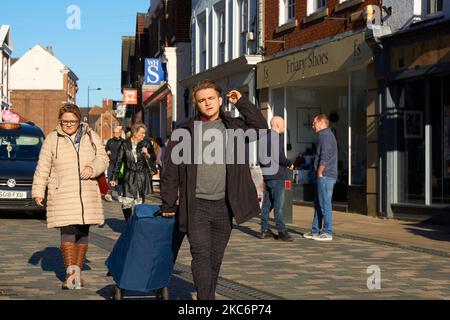 Shoppers on a high street Uttoxeter, Staffordshire, UK Stock Photo