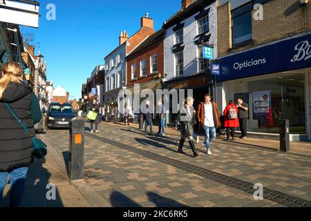 Shoppers on a high street Uttoxeter, Staffordshire, UK Stock Photo