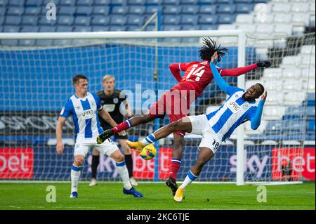 Isaac Mbenza of Huddersfield Town battles with Ovie Ejaria of Readingduring the Sky Bet Championship match between Huddersfield Town and Reading at the John Smith's Stadium, Huddersfield on Saturday 2nd January 2021. (Photo by Pat Scaasi/MI News/NurPhoto) Stock Photo