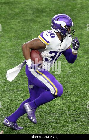 Minnesota Vikings fullback C.J. Ham (30) celebrates after his touchdown  with offensive tackle Brian O'Neill, right, in the second half of an NFL  football game against the Buffalo Bills, Sunday, Nov. 13, 2022, in Orchard  Park, N.Y. (AP Photo/Jeffrey T. 