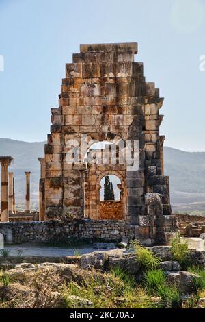 Ruins of the Basilica in the ancient Roman town of Volubilis in Meknes, Morocco, Africa. Volubilis is a partly excavated Roman city built in the 3rd century BC onwards as a Phoenician (and later Carthaginian) settlement. The site was excavated and revealed many fine mosaics, including some of the more prominent public buildings and high-status houses were restored or reconstructed. Today it is a UNESCO World Heritage Site , listed for being 'an exceptionally well preserved example of a large Roman colonial town on the fringes of the Empire'. (Photo by Creative Touch Imaging Ltd./NurPhoto) Stock Photo
