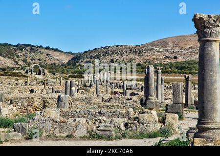 The ruins of the ancient Roman town of Volubilis in Meknes, Morocco, Africa. Volubilis is a partly excavated Roman city built in the 3rd century BC onwards as a Phoenician (and later Carthaginian) settlement. The site was excavated and revealed many fine mosaics, including some of the more prominent public buildings and high-status houses were restored or reconstructed. Today it is a UNESCO World Heritage Site , listed for being 'an exceptionally well preserved example of a large Roman colonial town on the fringes of the Empire'. (Photo by Creative Touch Imaging Ltd./NurPhoto) Stock Photo