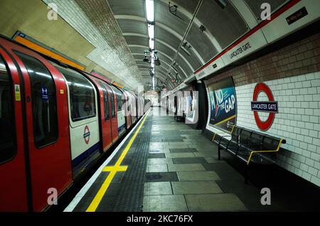 A Central line tube train prepares to pull off from an empty platform at Lancaster Gate Station on the London Underground network in London, England, on January 9, 2021. England began a third national lockdown on Tuesday in a bid to stem coronavirus transmission across the country. In the capital, Mayor of London Sadiq Khan yesterday declared a 'major incident' for the city over coronavirus pressures, warning that hospitals could soon be overwhelmed with patients with covid-19. (Photo by David Cliff/NurPhoto) Stock Photo